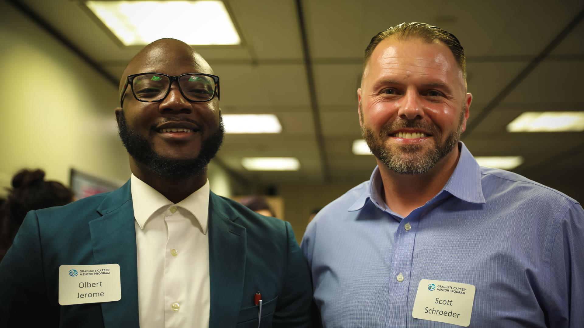 Two People Smiling at the Camera