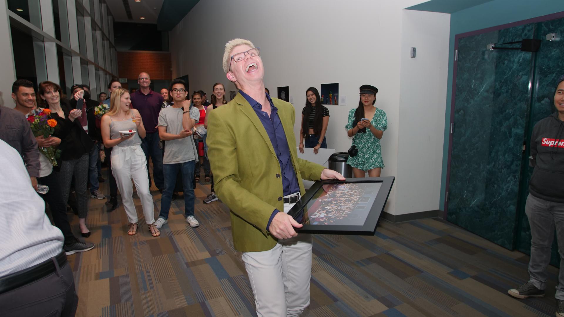 Andrew Vaca receives thank you photo from students and staff