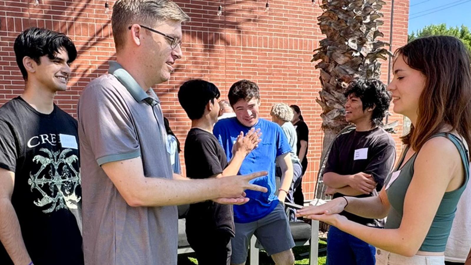 students and faculty engaged in an outside activity