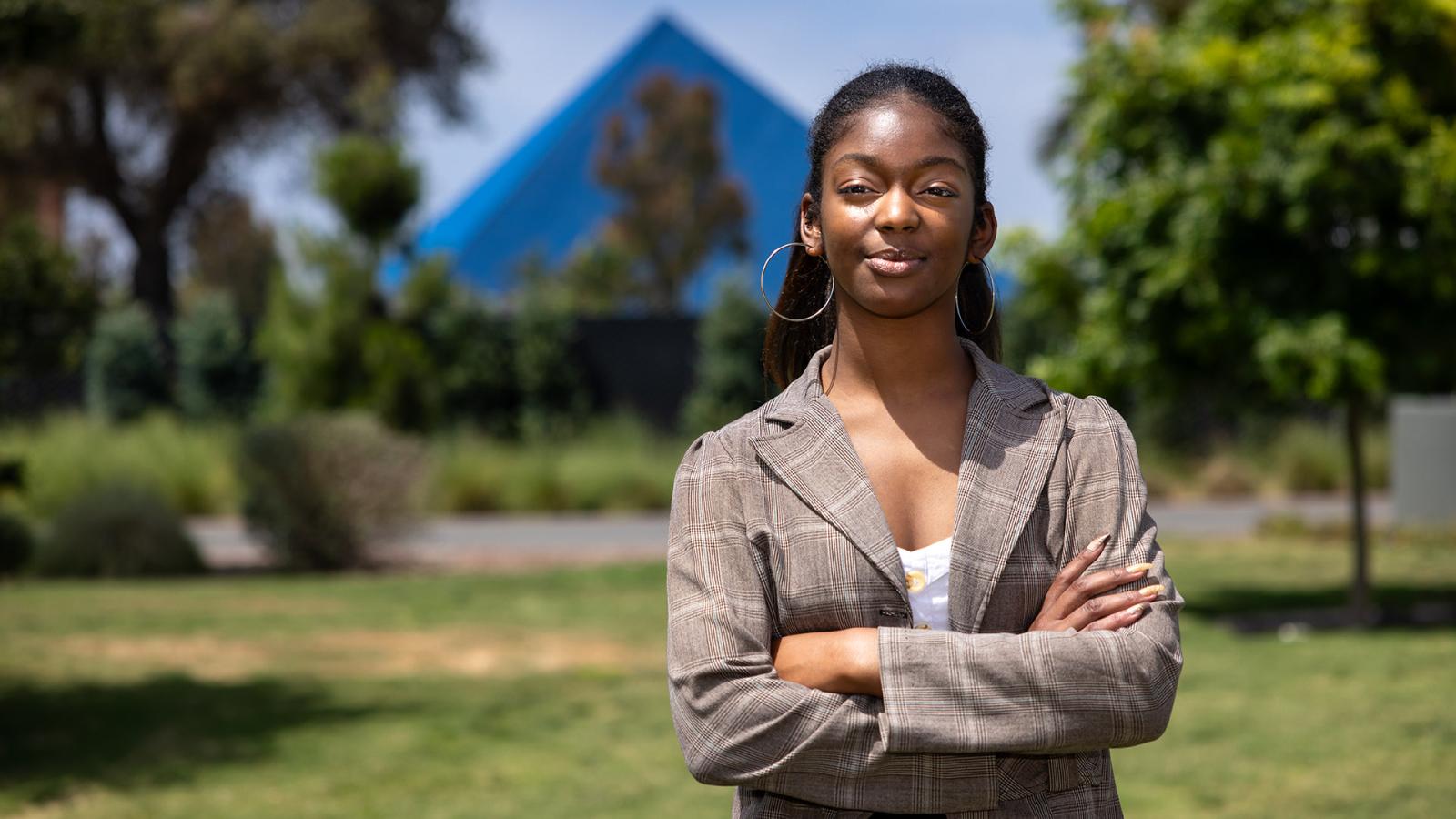 Student Chloe Thomas, an inaugural recipient of the Black Student Success Scholarship, with Walter Pyramid in background