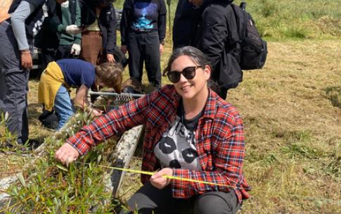 Student showing her research at River Ridge Ranch