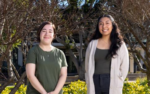 Teaching students Marisa Saxon, left, and Jorgely Jimenez 