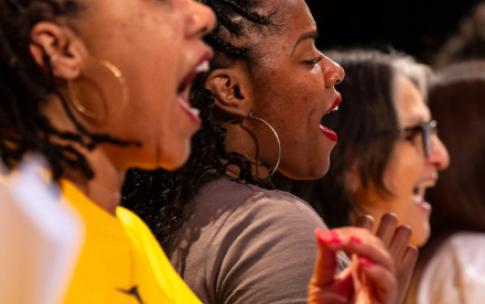 Members of the Community Gospel Choir Concert sing, close-up shot