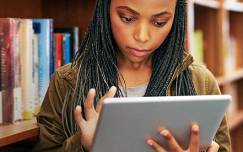 Female student looking at iPad