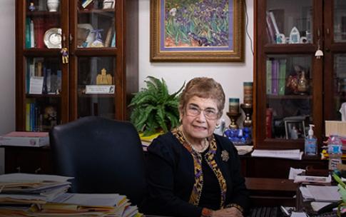 Dr. Lucy Huckabay sitting at a desk