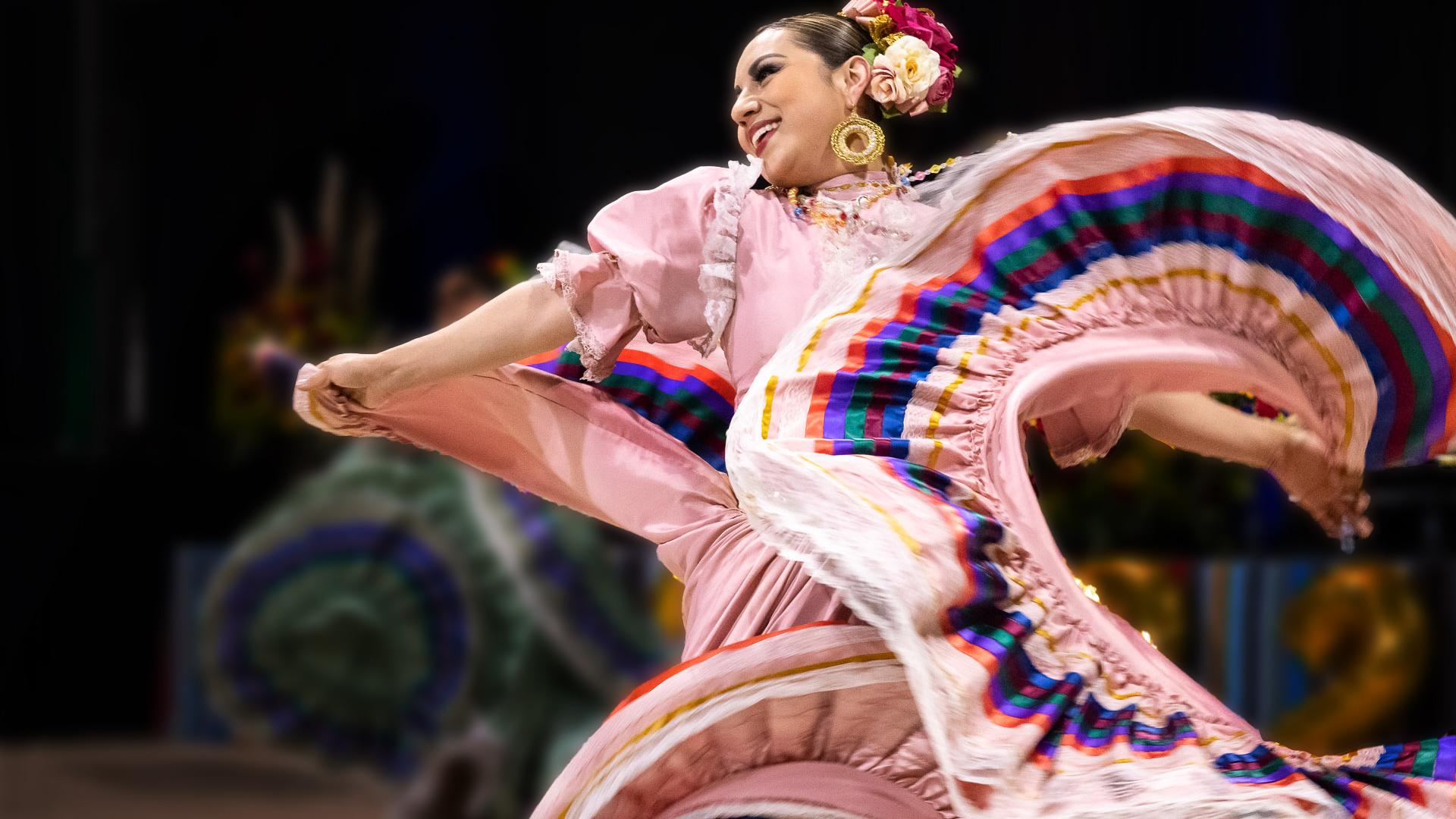 Dancer in colorful dress for Latine History Month