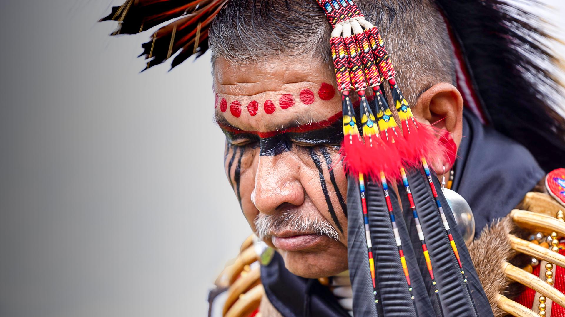 Photo of Native American man in Native regalia