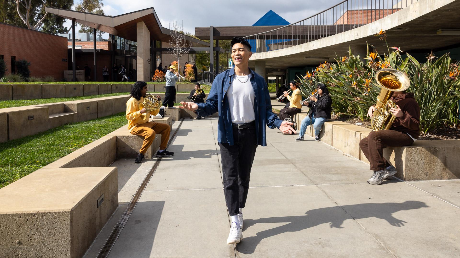 VJ Rosales sings outside the Bob Cole Conservatory of Music