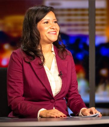 Liz Hanna at the Beach TV News anchor desk