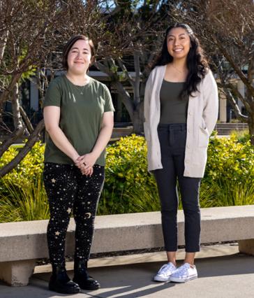 Teaching students Marisa Saxon, left, and Jorgely Jimenez 