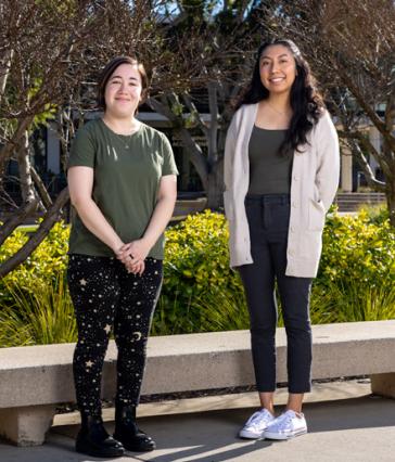 Teaching students Marisa Saxon, left, and Jorgely Jimenez 