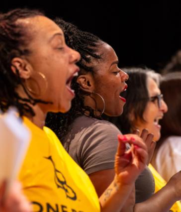 Members of the Community Gospel Choir Concert sing, close-up shot