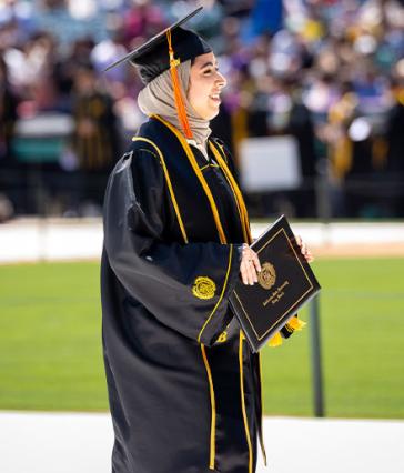 A CSULB graduate wearing a hijab