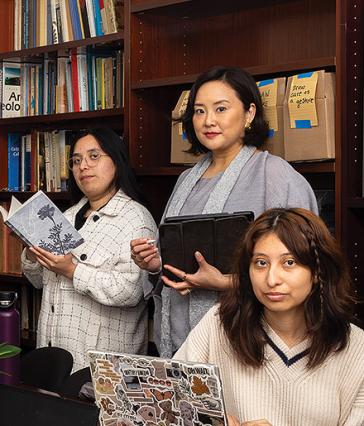 Two students and a professor (middle) at the Genre conference room at CSULB
