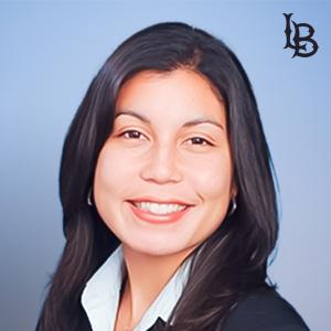 A portrait of 49er Foundation board member Rosalie Barcinas with the "LB" logo in the upper right corner