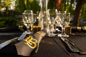 Wine glasses and an black napkin with LB logo