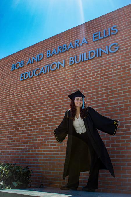 Chloe Haynes stands outside the College of Education building