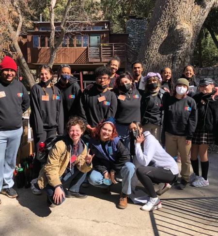 Chloe Haynes poses with a group of young people at a CCEJ camp.