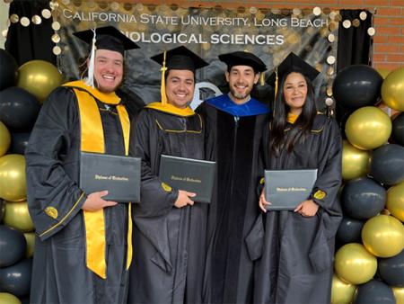 Peter Ramirez with M.S. graduates at commencement