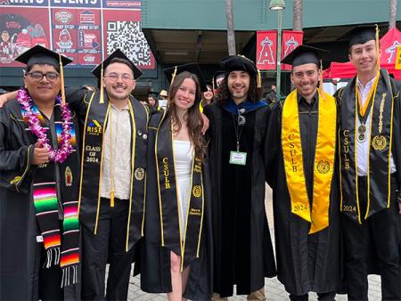 Peter Ramirez with undergraduates at commencement