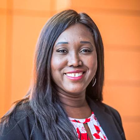 Fatou Olshanski in front of orange background