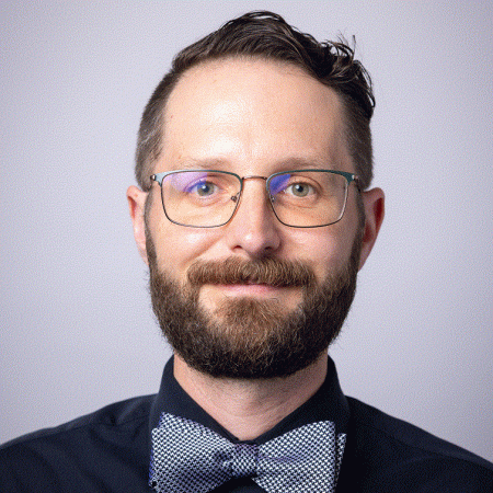 Photograph of Gabriel J. Gardner, bearded Caucasian man wearing a bowtie. 