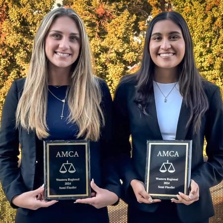 Moot Court winners Kylie Barnhart and Ivonne Sotelo Two students hold AMCA plaques
