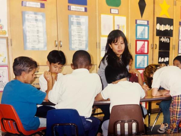 Nat Hansuvadha teaching children in a classroom