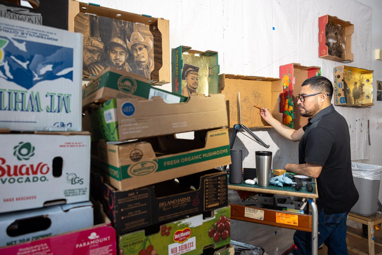 Narsiso Martinez paints in his studio