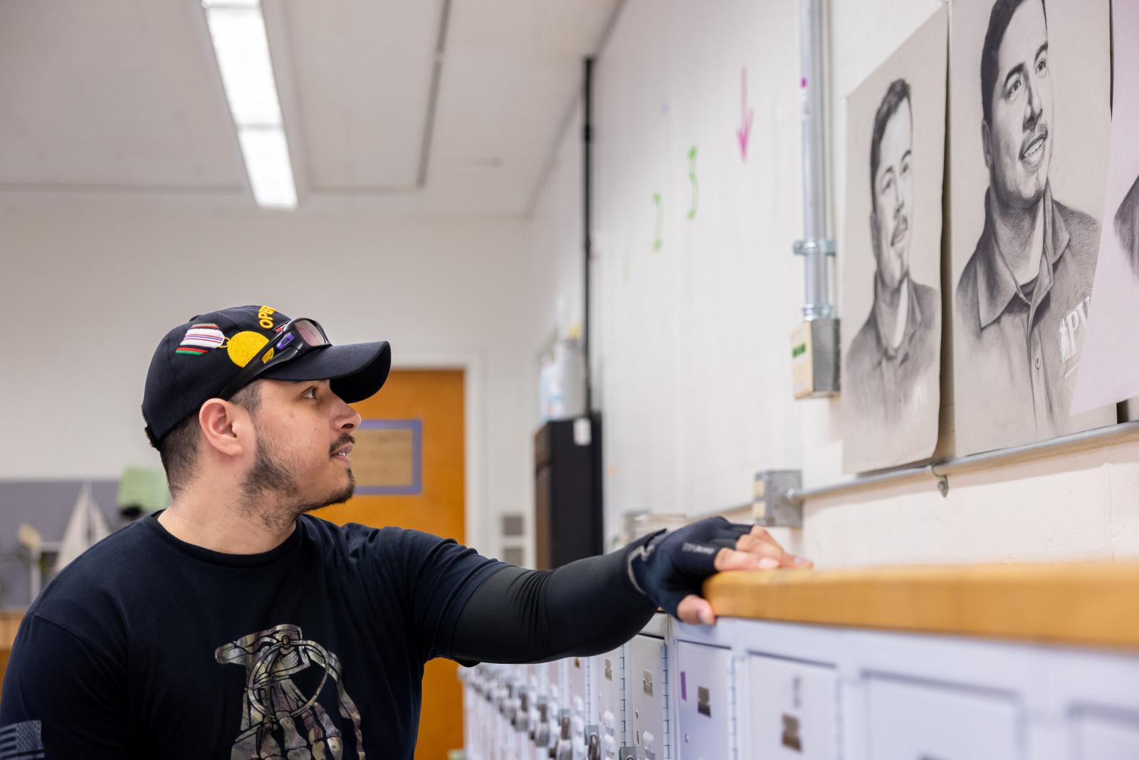 Jose Reynoso reviewing CSULB students' portraits