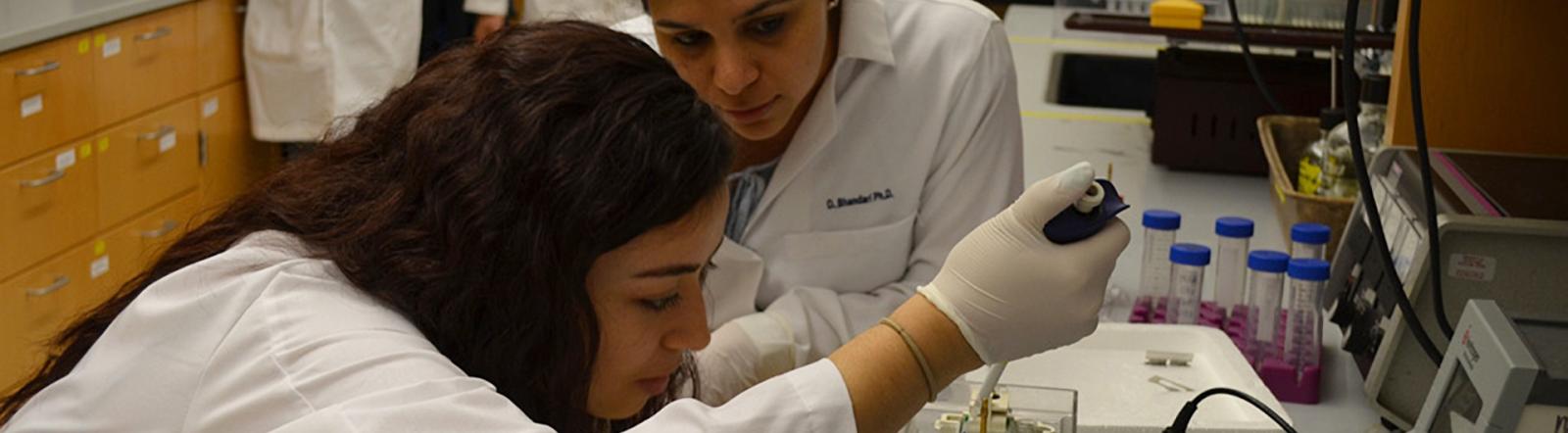 student and teacher in the lab