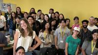 A group of students smiling at the camera.